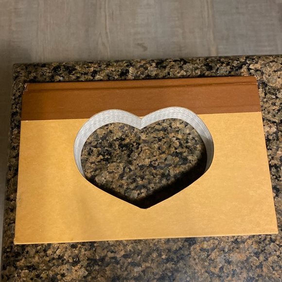 It’s a book with a heart cut into it. - Picture 2 of 3